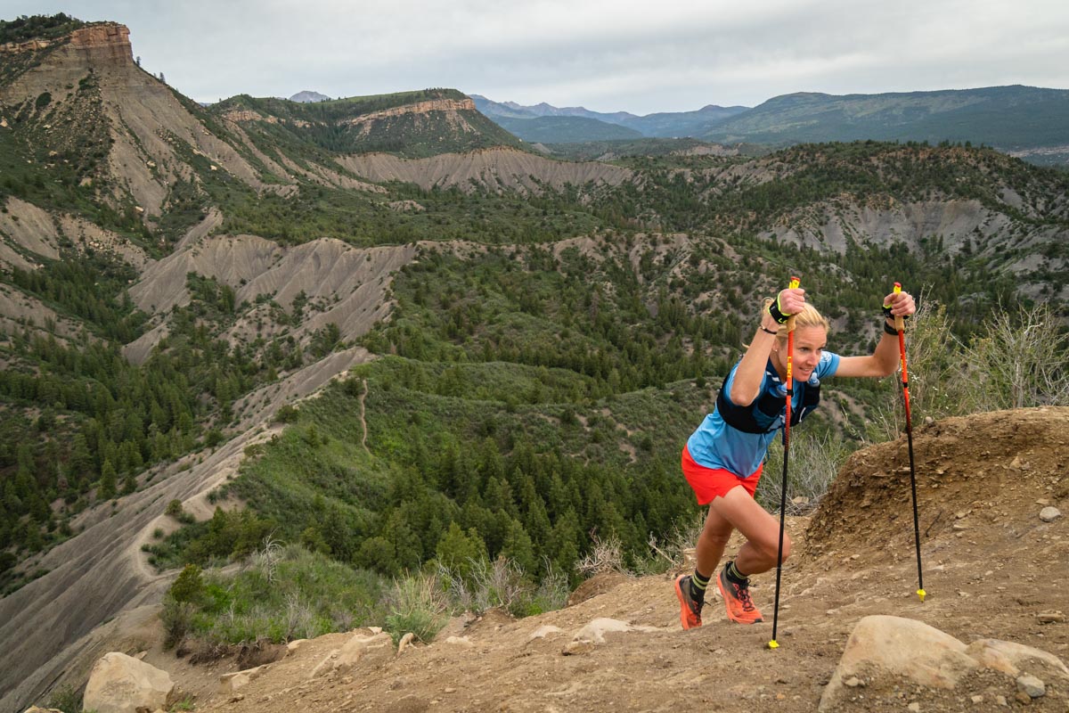 Best running shirts for women - climbing ridge with poles
