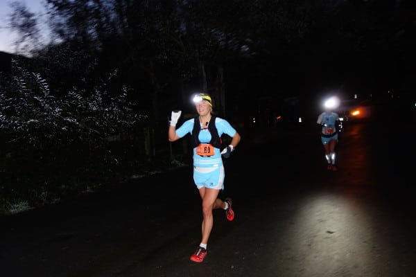 Emelie Forsberg running in the pre-dawn. Photo: iRunFar/Meghan Hicks